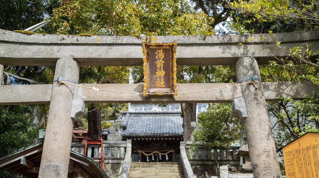 Yuzen Shrine which includes heritage elements, signage and a temple or place of worship