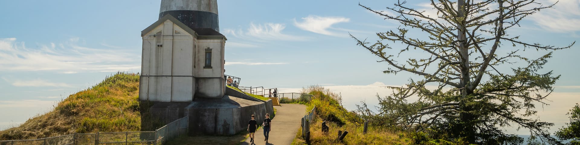 Cape Disappointment Lighthouse featuring a lighthouse as well as a couple