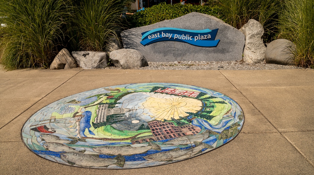 East Bay Public Plaza featuring outdoor art and signage