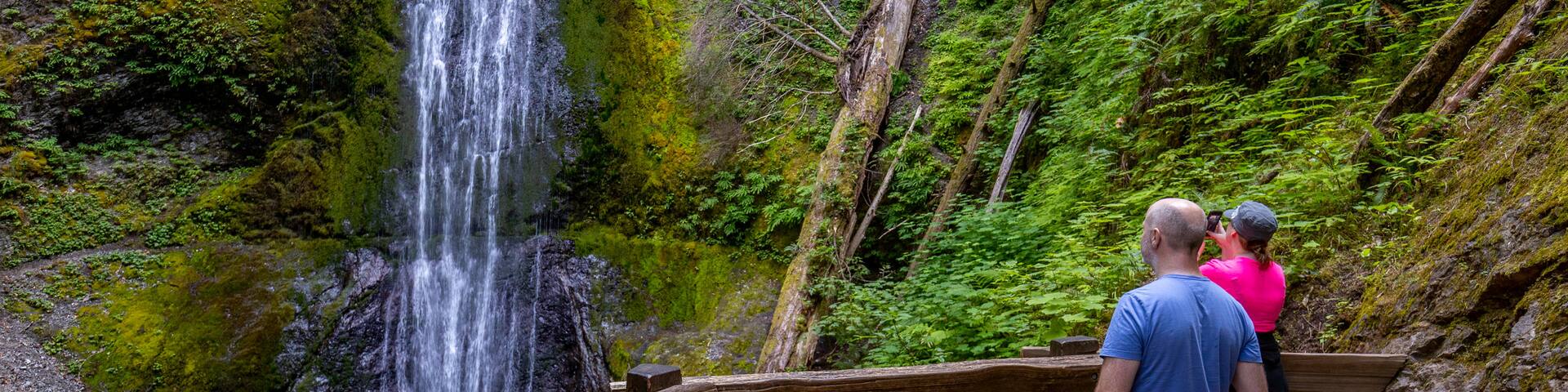 Marymere Falls which includes a waterfall as well as a couple