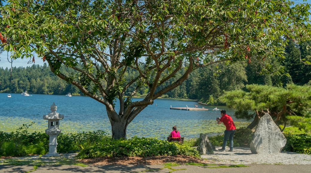 Seward Park featuring a lake or waterhole as well as a couple