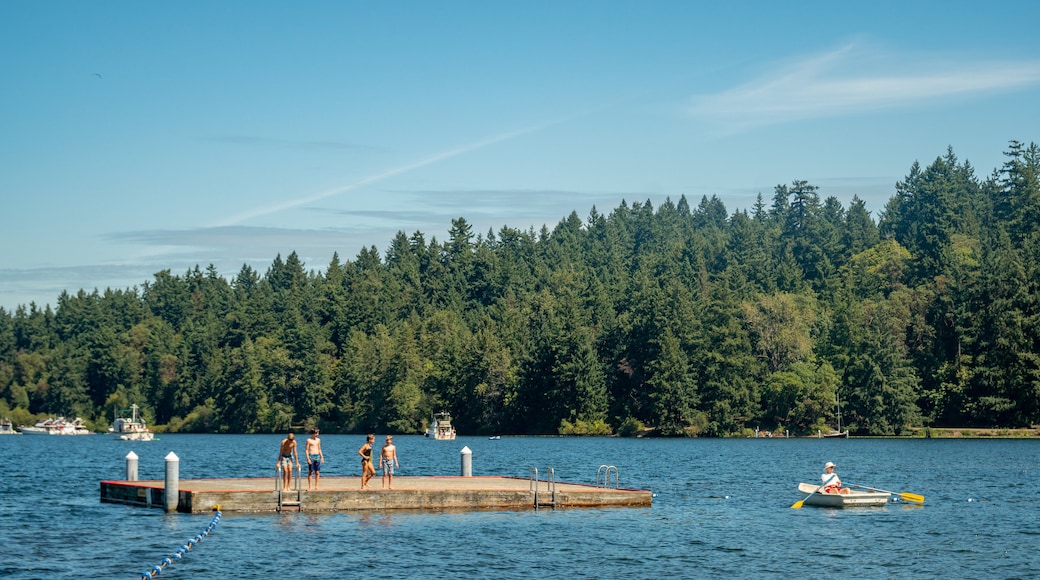 Seward Park showing a lake or waterhole and boating as well as a small group of people