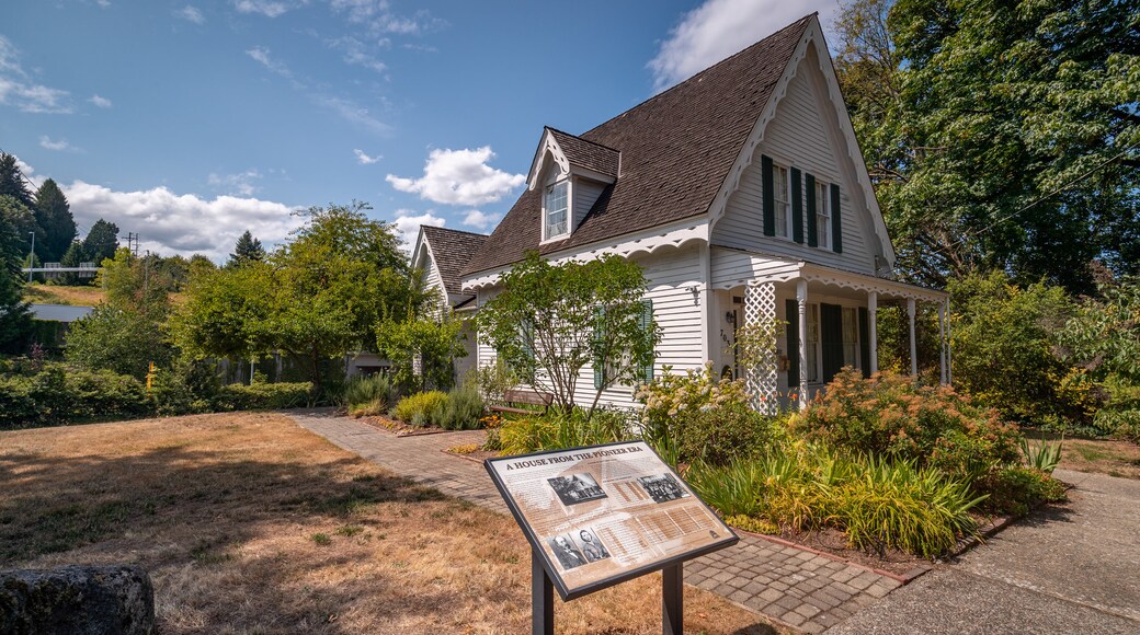 Tumwater featuring heritage elements, signage and a house