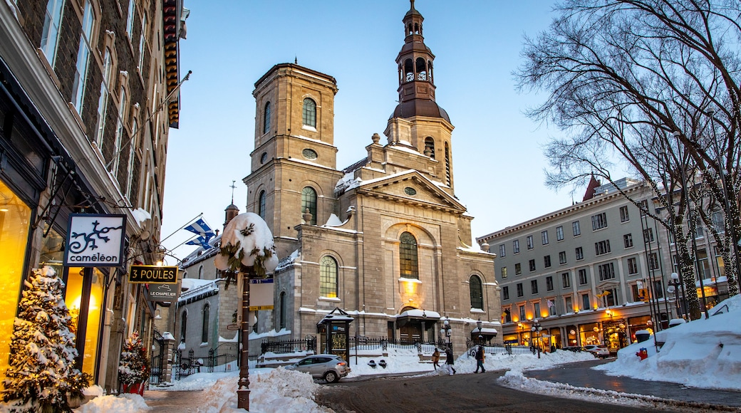 Old Quebec featuring snow, a church or cathedral and heritage architecture