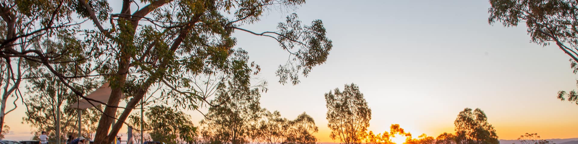 Mount Gravatt Lookout showing a sunset and tranquil scenes as well as a couple