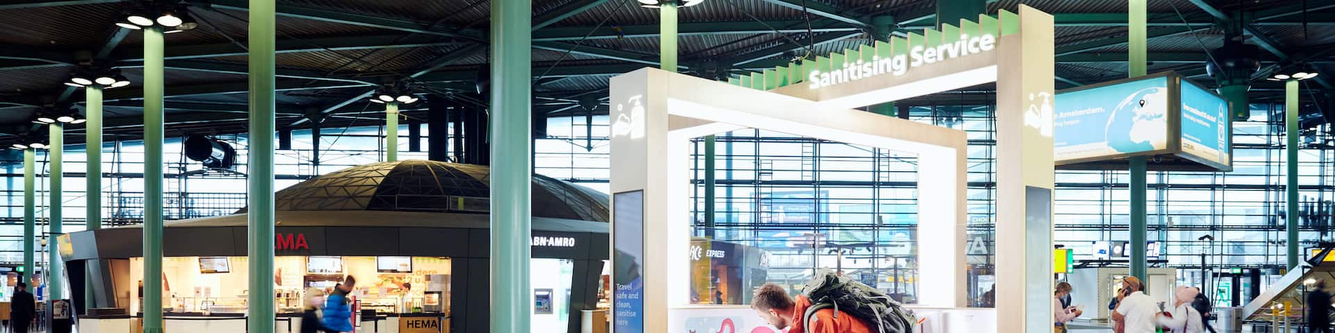 Amsterdam showing interior views and an airport as well as a family