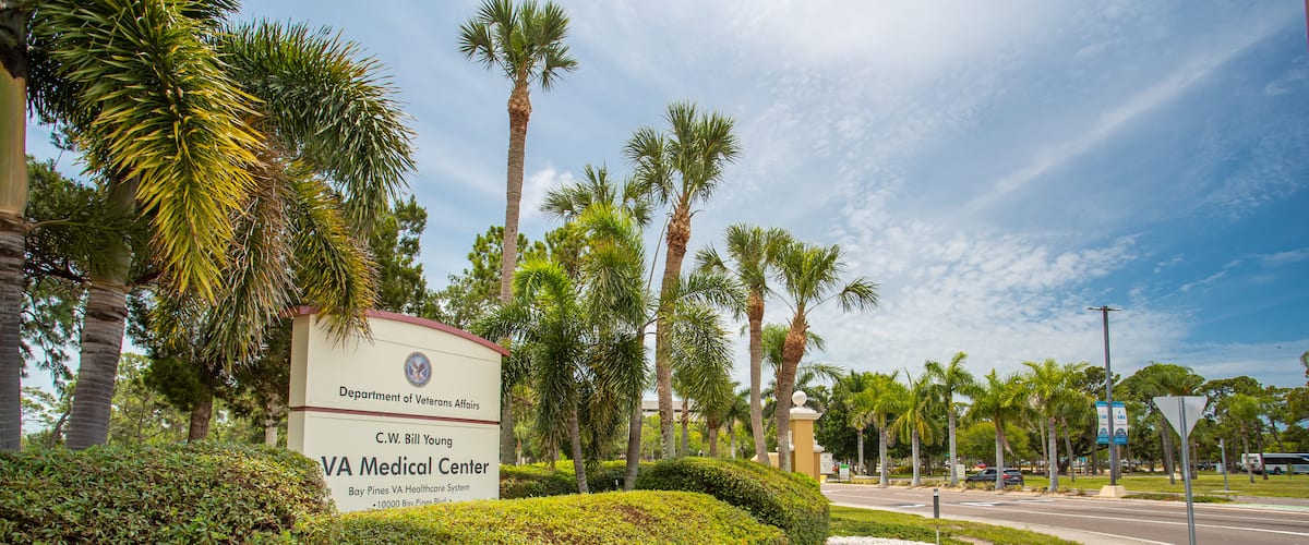 Bay Pines VA Medical Center featuring signage and a garden