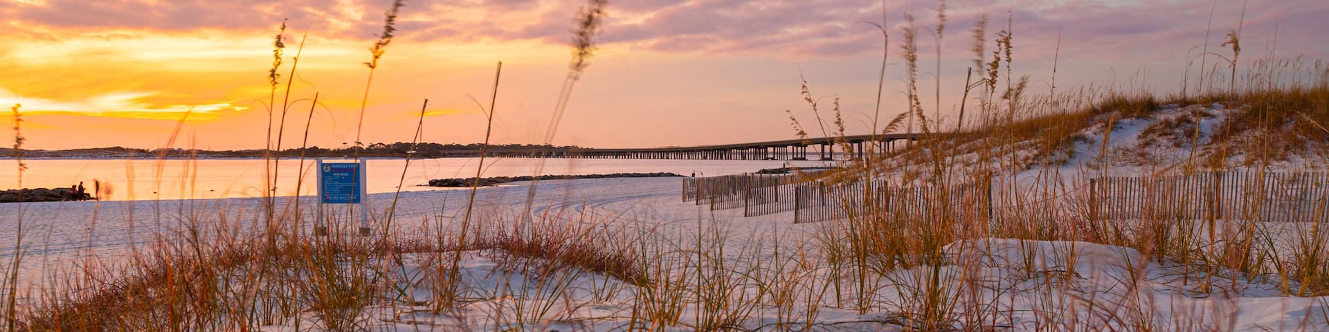 Destin showing general coastal views, a sandy beach and a sunset