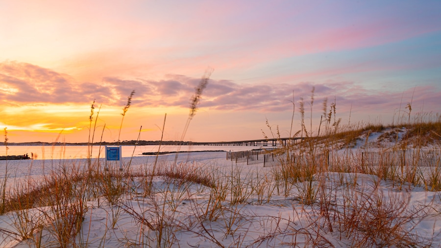 Destin showing general coastal views, a sandy beach and a sunset
