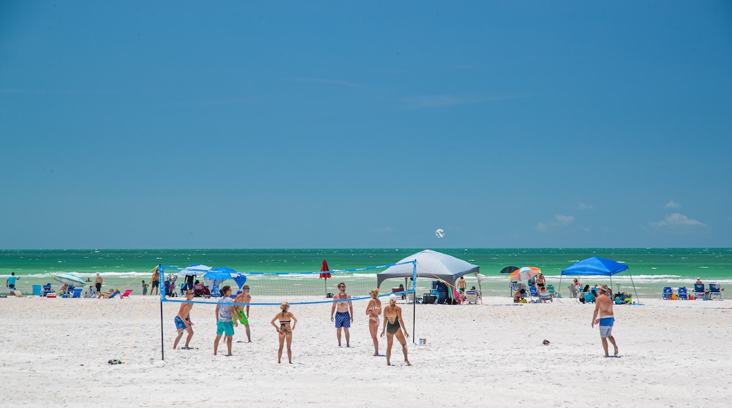 Lido Beach showing a sandy beach and general coastal views as well as a small group of people