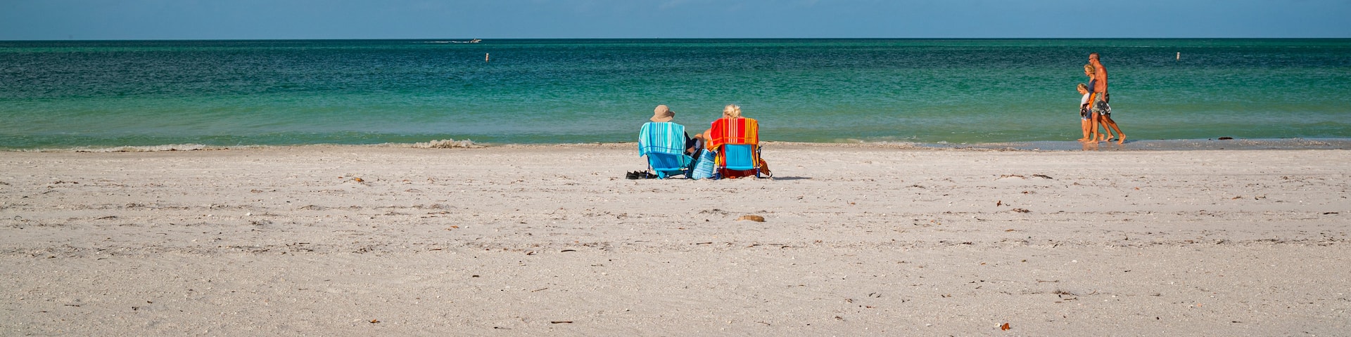Treasure Island featuring general coastal views and a sandy beach as well as a couple