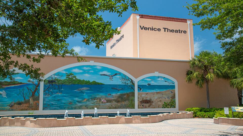 Venice Theater featuring signage and outdoor art