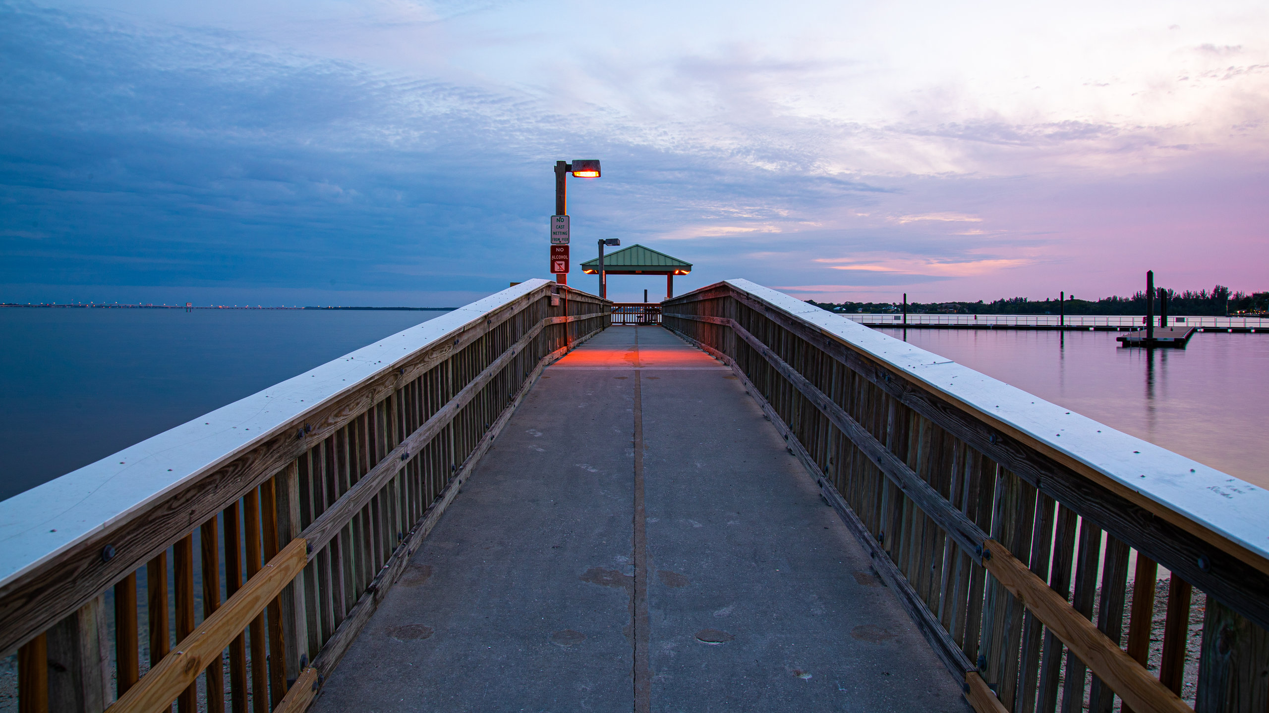 North Fort Myers which includes a sunset, a bay or harbor and a bridge