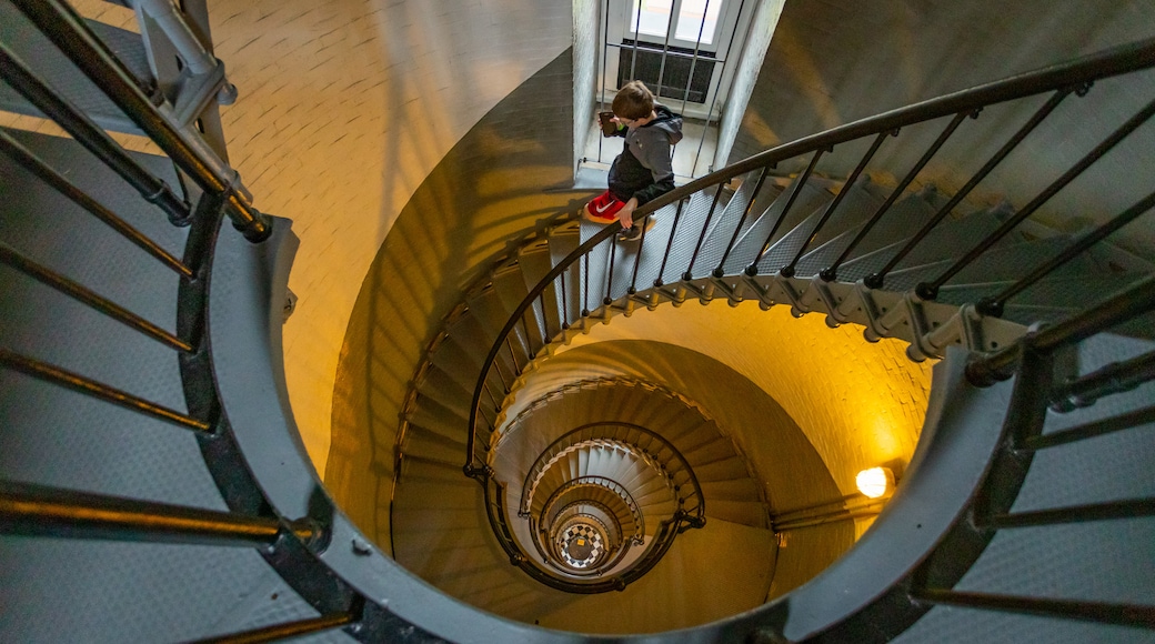 Ponce de Leon Inlet Lighthouse and Museum featuring interior views and a lighthouse