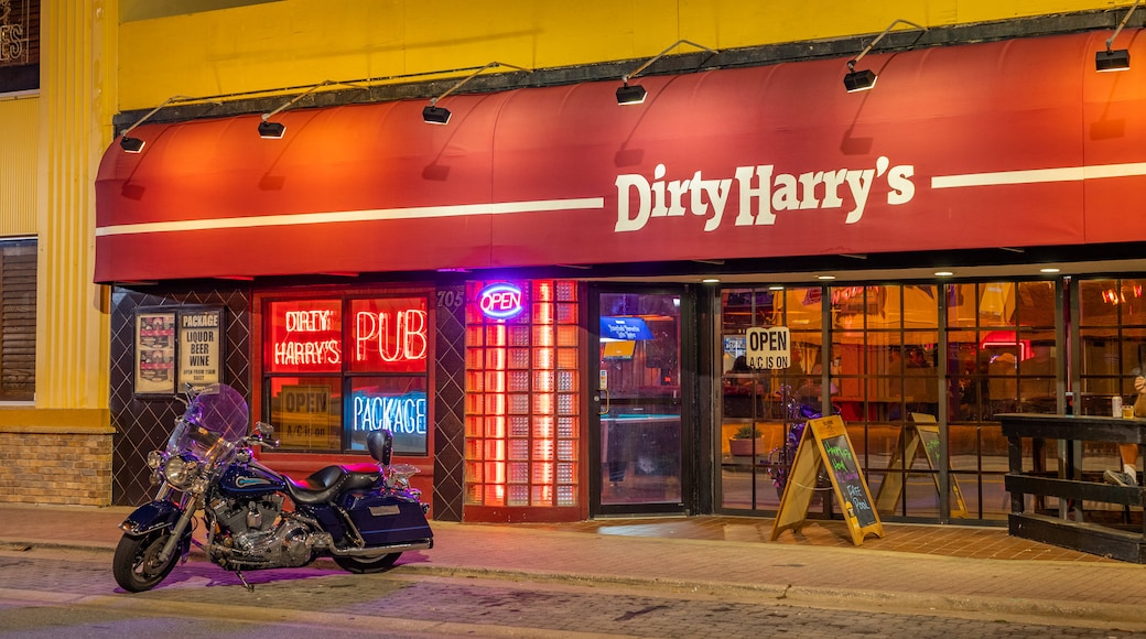 Daytona Beach featuring signage and a bar