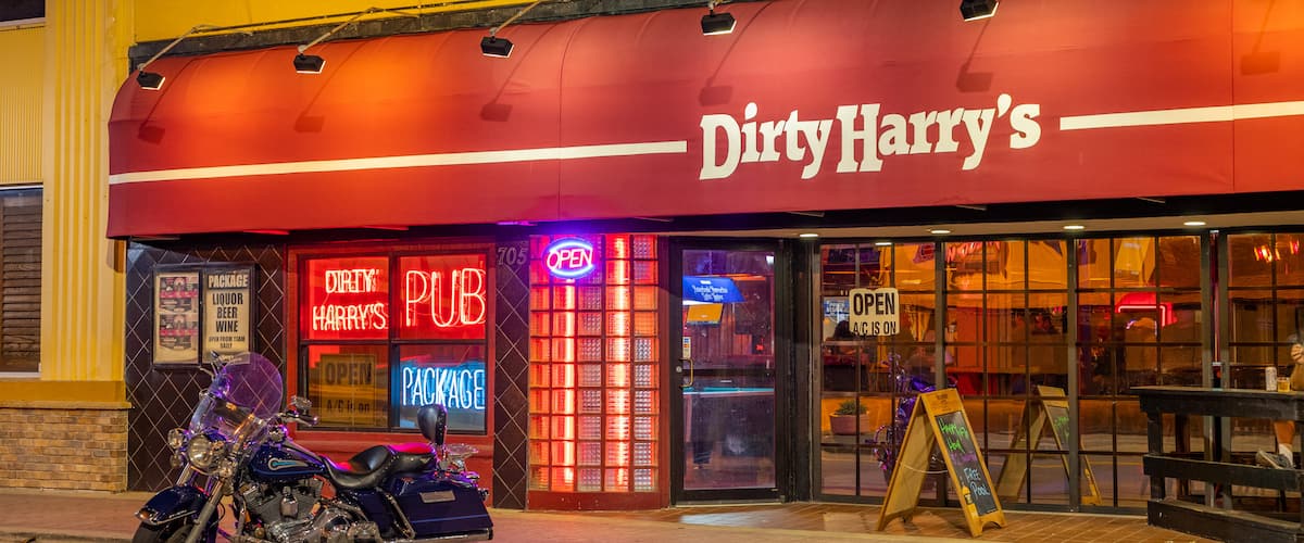 Daytona Beach featuring signage and a bar