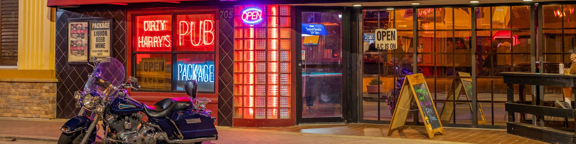 Daytona Beach featuring signage and a bar