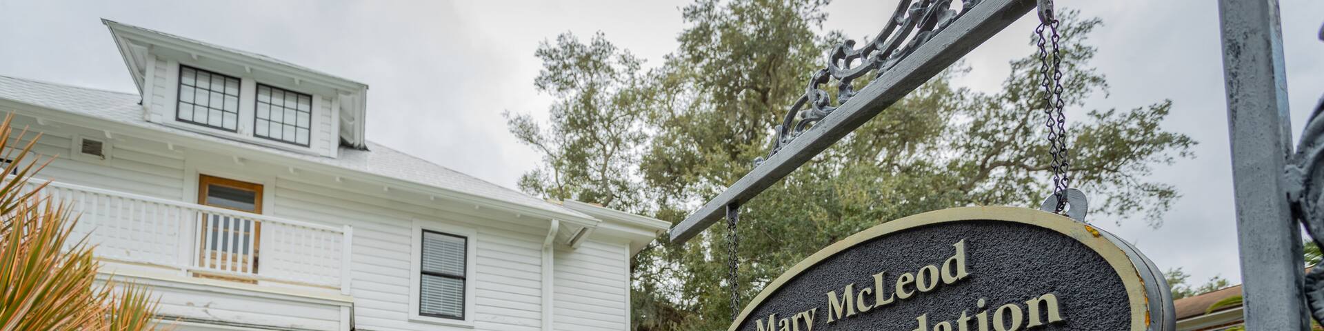 Mary Bethune Home featuring signage and a house