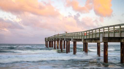 St. Johns County Ocean Pier which includes a sunset and general coastal views