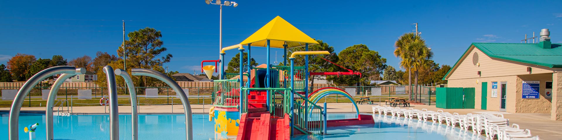 Frank Brown Park showing a pool and a playground
