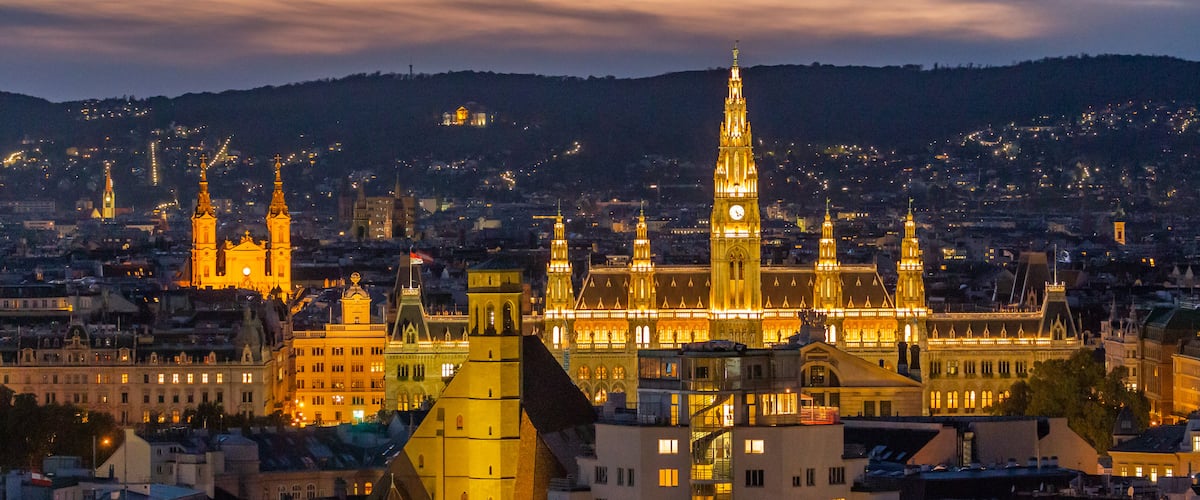 Vienna City Hall Area showing a sunset, night scenes and a city