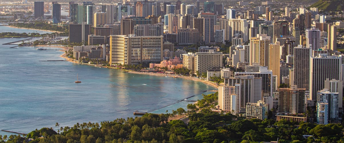 Diamond Head which includes a city, landscape views and a sunset