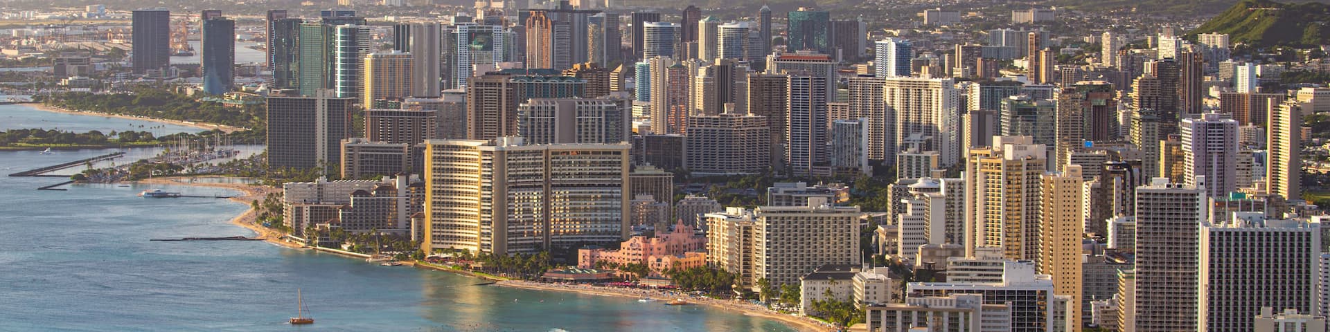 Diamond Head which includes a city, landscape views and a sunset