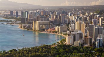 Diamond Head which includes a city, landscape views and a sunset