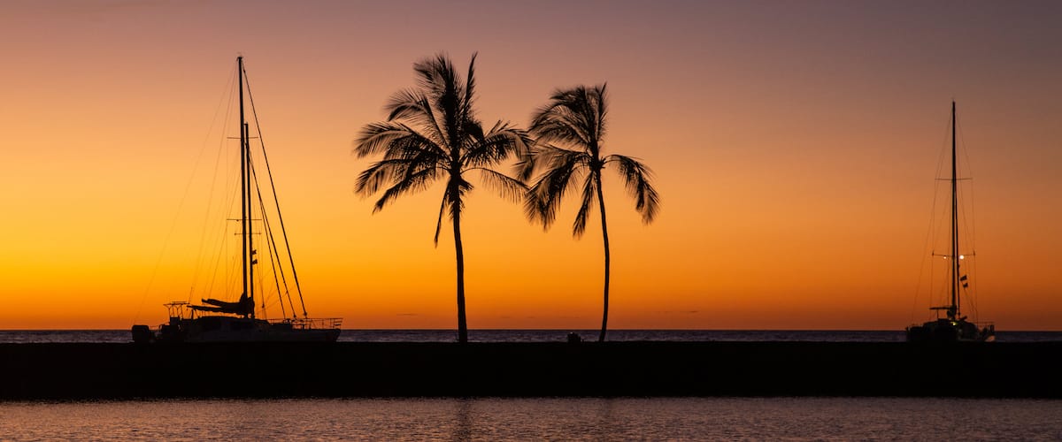 Waikoloa showing sailing, a sunset and tropical scenes
