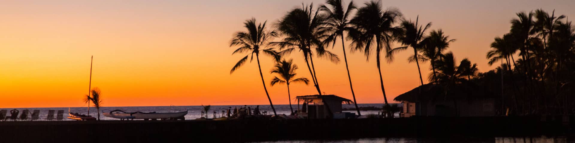 Waikōloa Beach which includes a sunset, general coastal views and tropical scenes