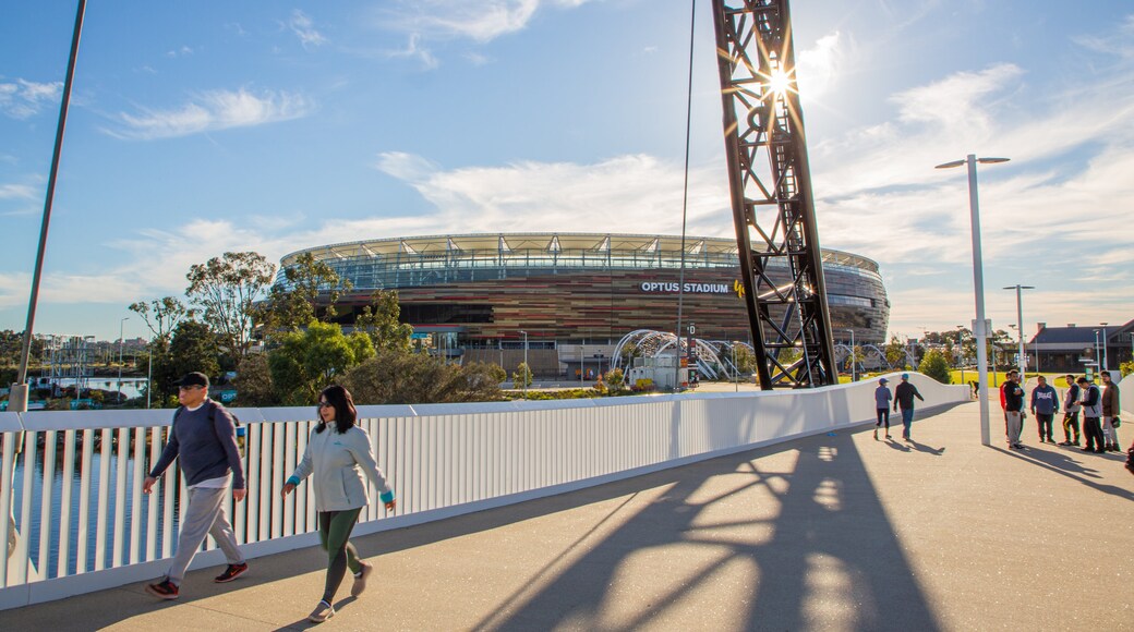 Optus Stadium showing a sunset as well as a couple