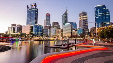 Elizabeth Quay which includes a sunset, a city and a bay or harbor