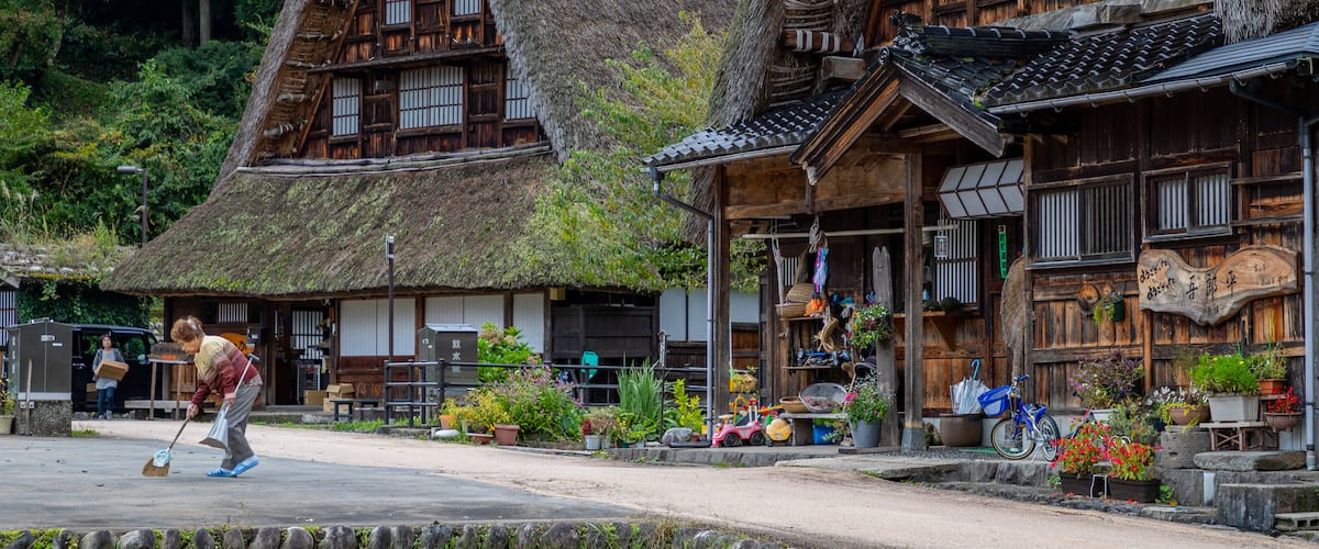 Nanto which includes a small town or village and street scenes as well as an individual femail