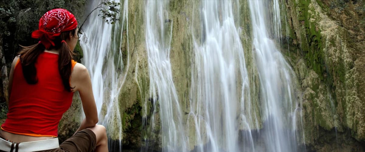 Los Haitises National Park showing a cascade and forest scenes as well as an individual femail