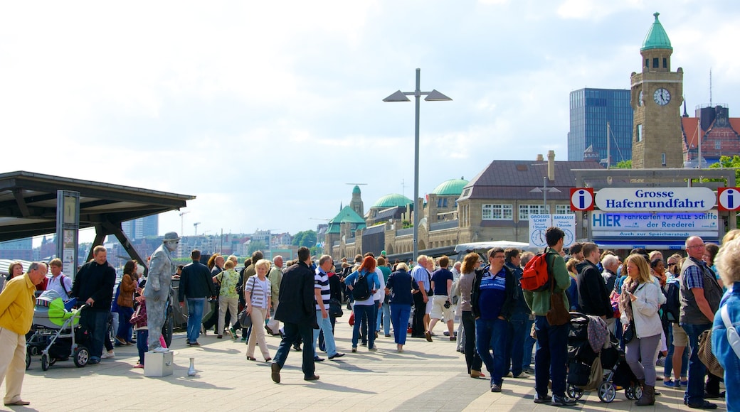 Hamburg showing a square or plaza and a city as well as a large group of people