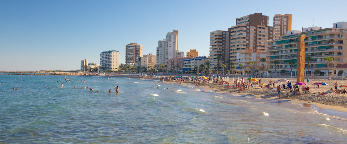 Campello Beach which includes swimming, a coastal town and a luxury hotel or resort