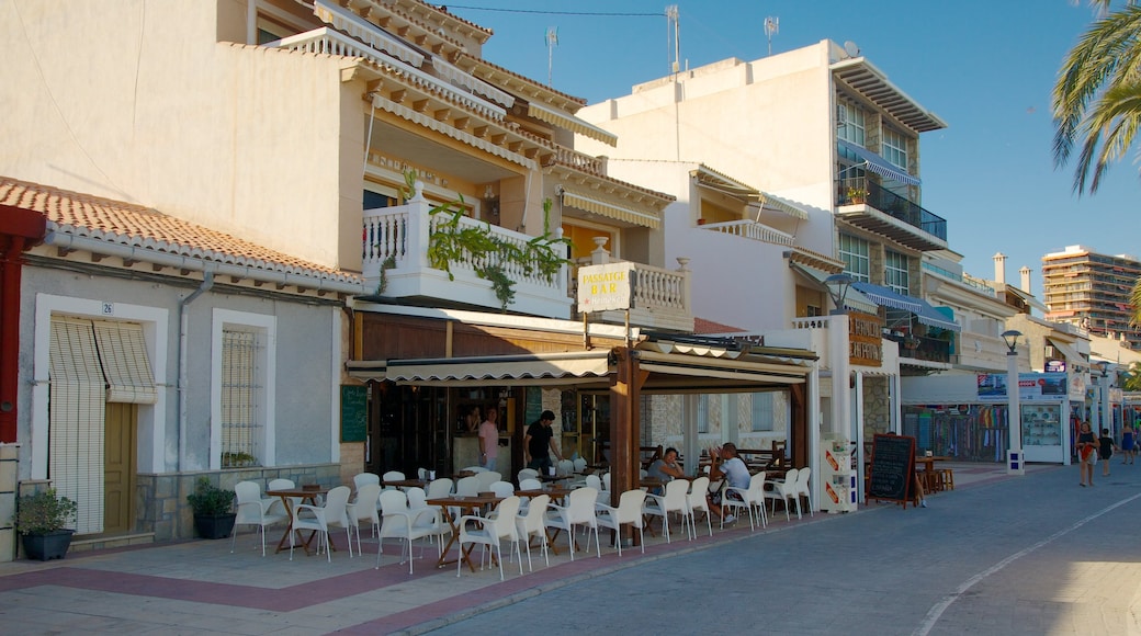 Campello Beach featuring street scenes, outdoor eating and a coastal town