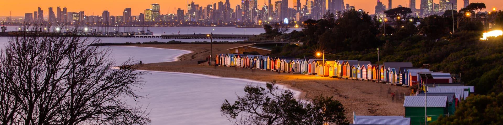 Brighton Beach featuring a city, a sunset and a beach