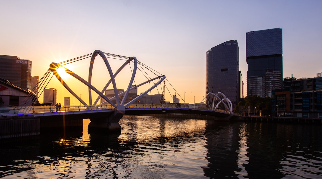 Southbank Promenade featuring a sunset, a bridge and a bay or harbor