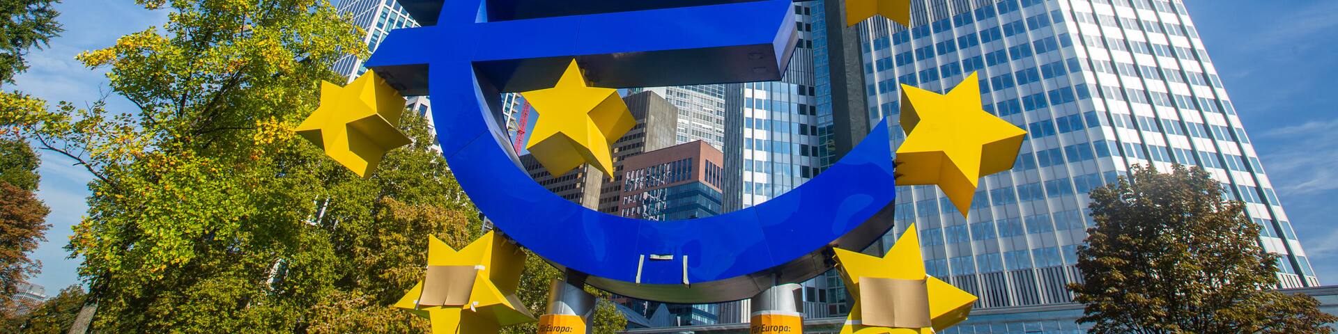 Euro Symbol which includes signage, a city and outdoor art