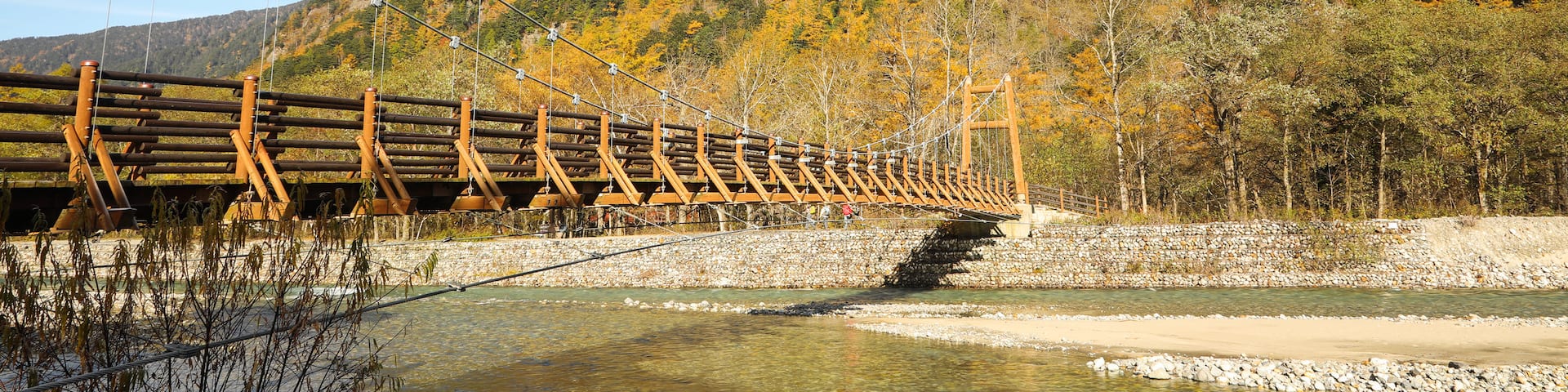Myojin Bridge which includes a river or creek, mountains and a bridge