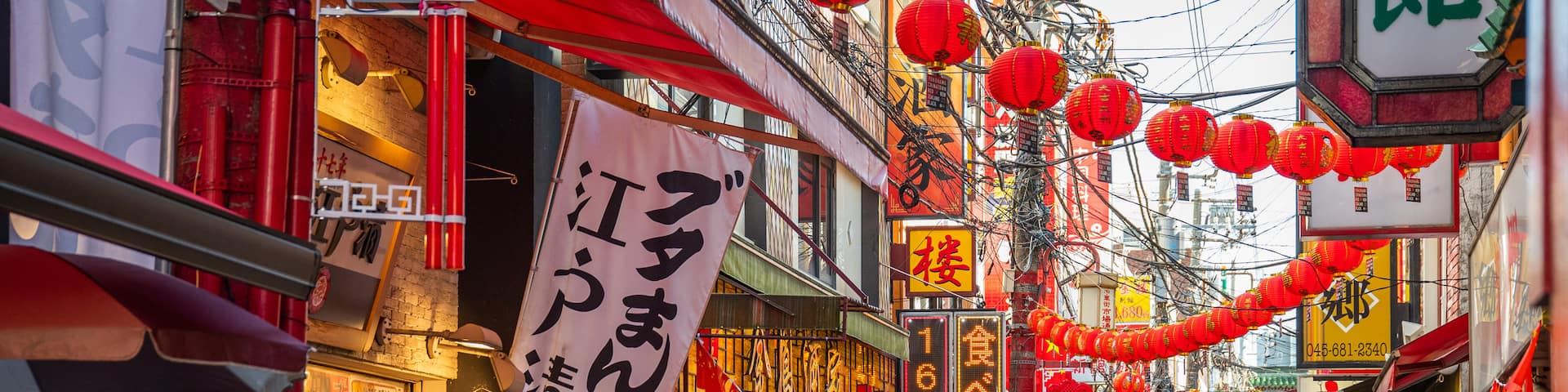 Chinatown which includes signage, a city and street scenes