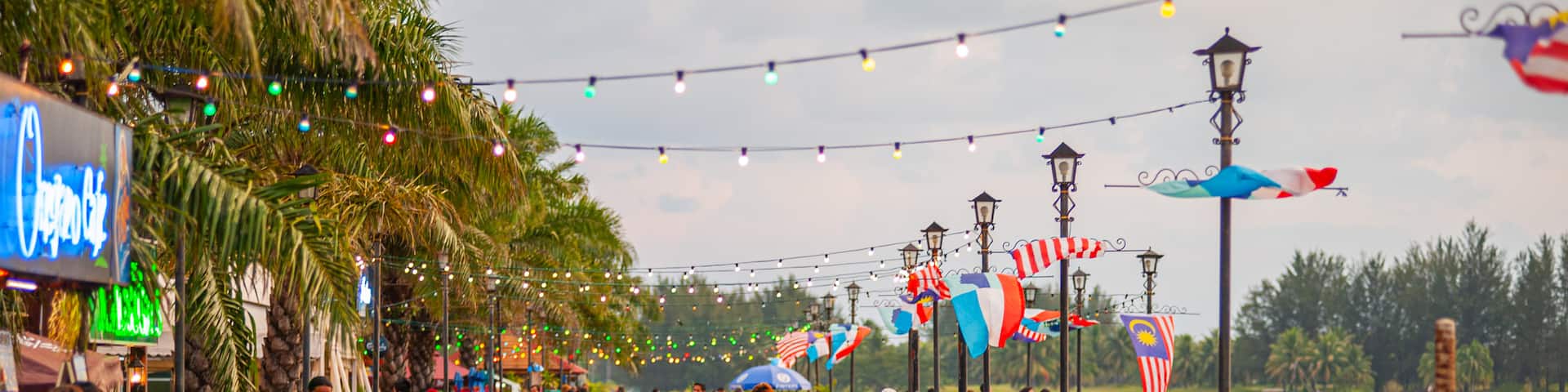 Kota Kinabalu Waterfront featuring outdoor eating as well as a large group of people