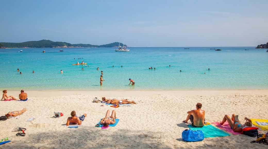 Perhentian Island which includes swimming, general coastal views and a beach