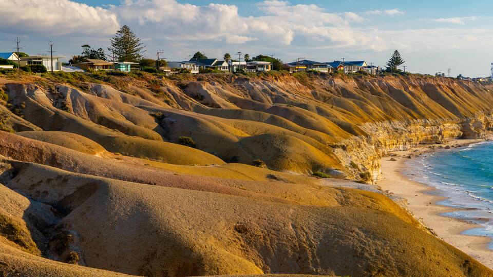 Port Willunga Beach featuring a coastal town, rugged coastline and general coastal views