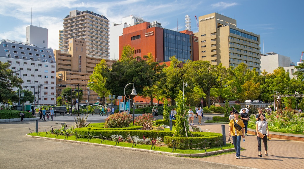 Yamashita Park which includes street scenes and a garden as well as a couple