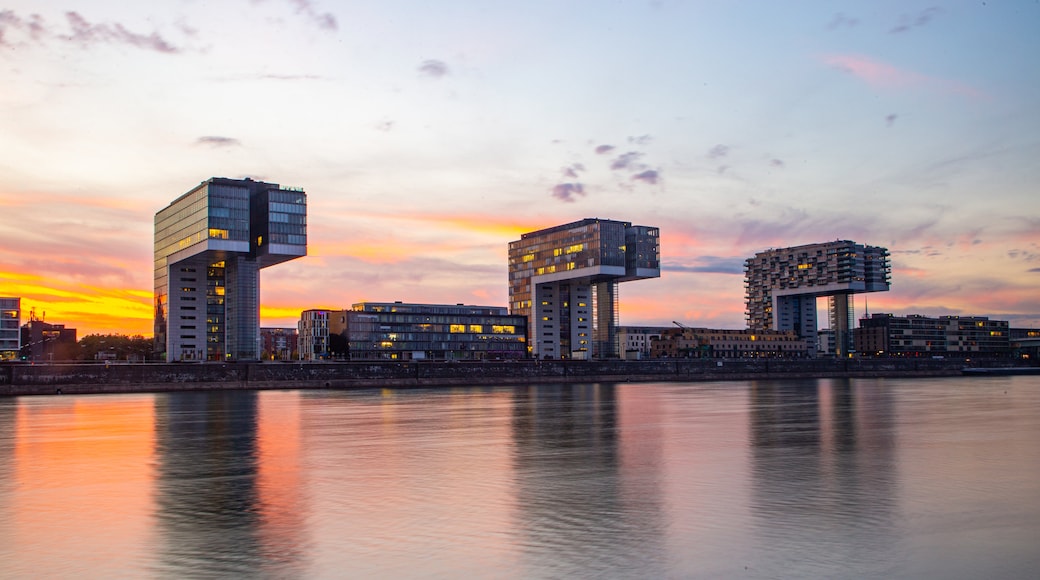 Rheinau Harbour showing a river or creek, a sunset and modern architecture