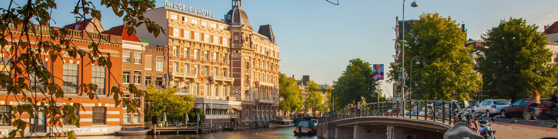 Muntplein which includes a river or creek, a bridge and a city