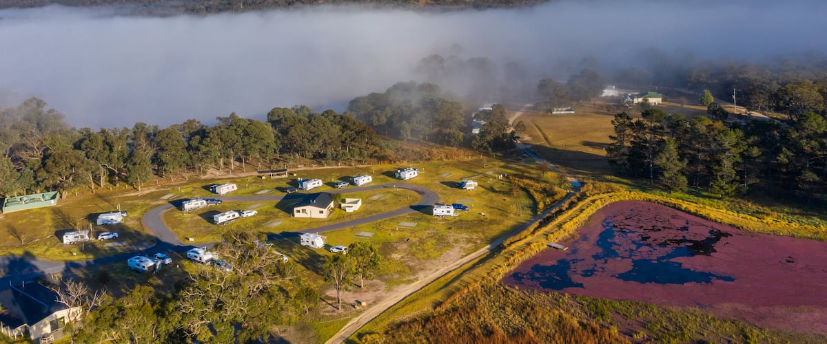 Storm King Dam showing a small town or village, landscape views and mist or fog