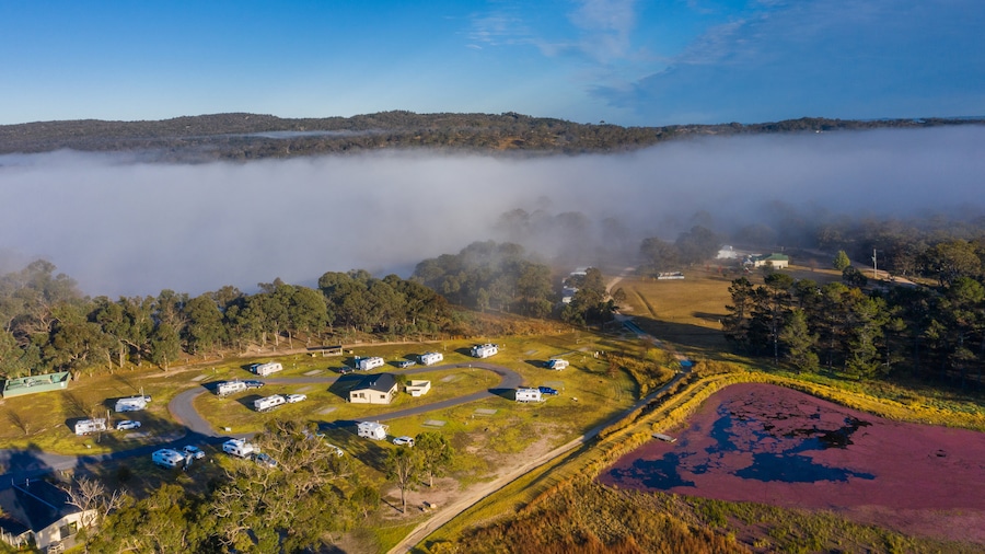 Storm King Dam showing a small town or village, landscape views and mist or fog